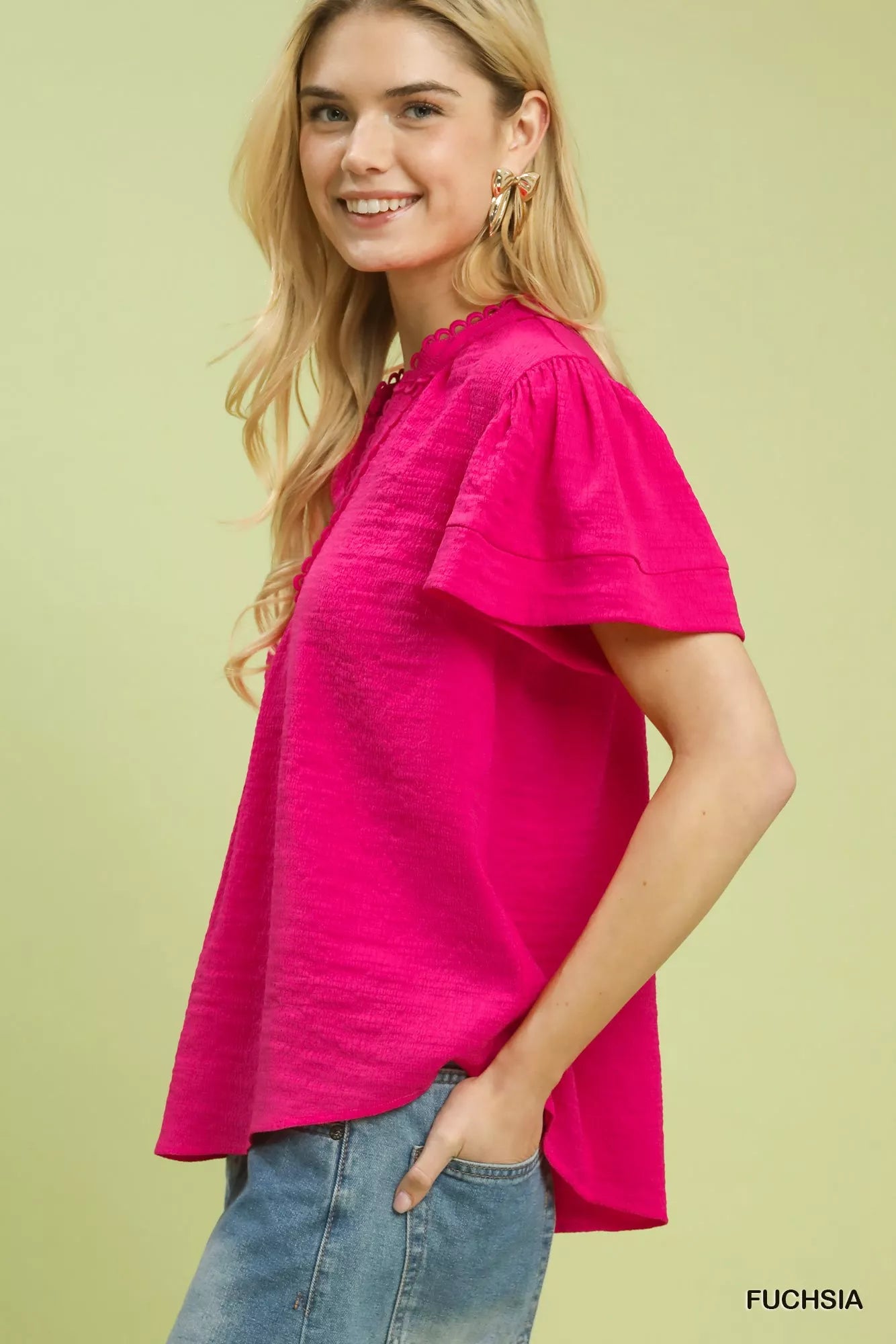 Side view of fuchsia umgee seersucker top with lace trim, 70% rayon 30% polyester, sizes S-L