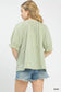 Back view of sage striped blouse with ruffled sleeves at Blueberi Boutique