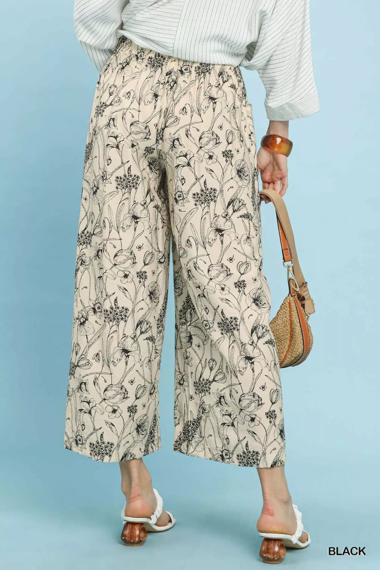 Umgee two-tone floral print pants back view displaying full-length black/white floral pattern