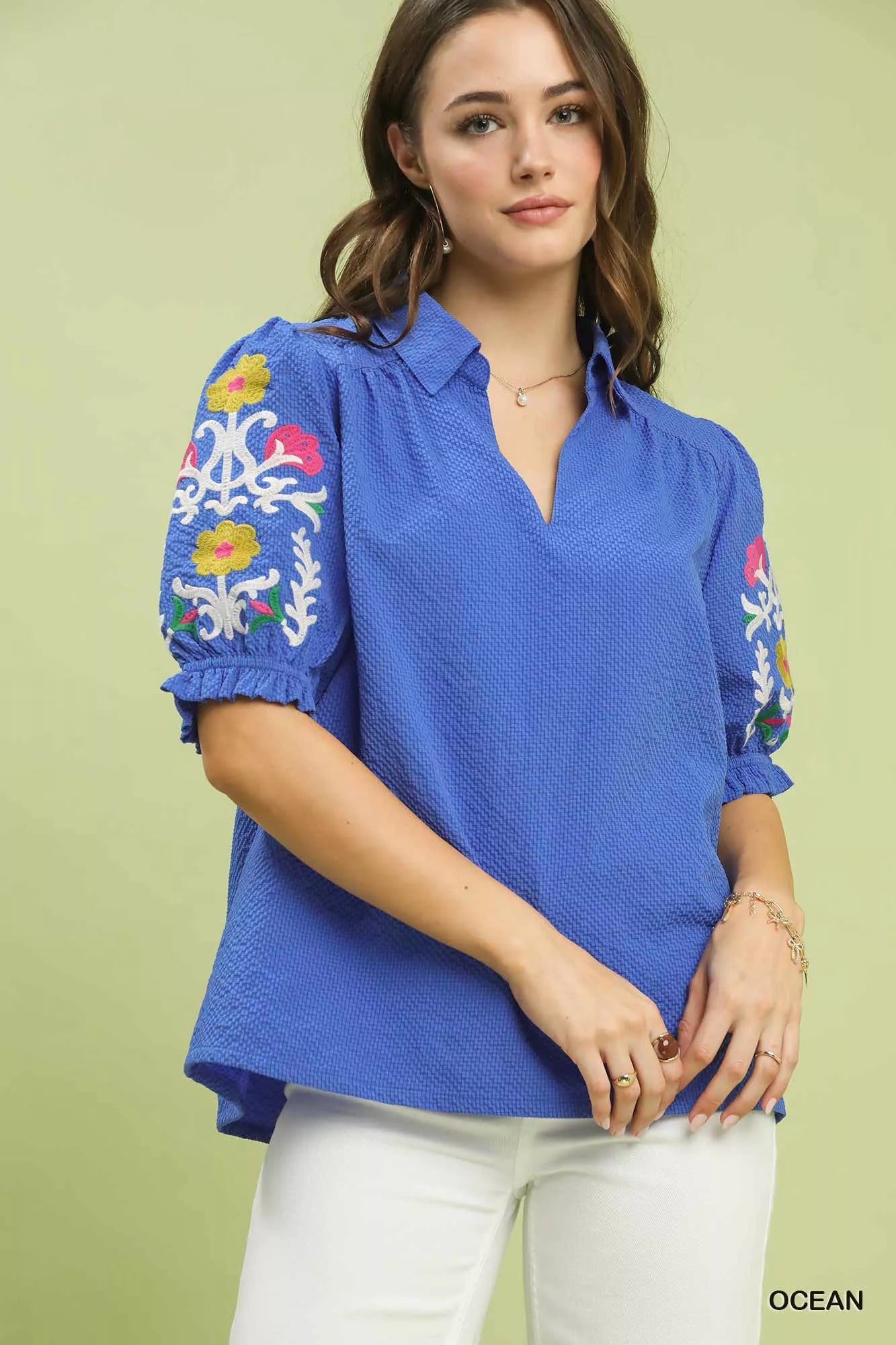 Umgee blue seersucker embroidered sleeve blouse with colorful floral embroidery