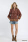 Umgee women's rosewood floral boho blouse paired with denim shorts
