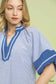 Blueberi Boutique Umgee blue striped mixed puff sleeve blouse close-up with V-neck