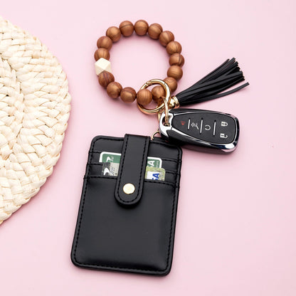 Luxe Silicone Bead Geo Wood Accent Gold Hardware Button Snap Key Ring Wallet Bracelet with Tassel | 4" x 3"