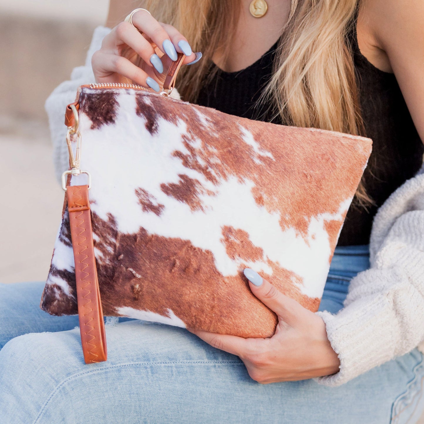 100% Polyester Faux Fur Cotton Lined Cow Print Removable Vegan Leather Wristlet Clutch
