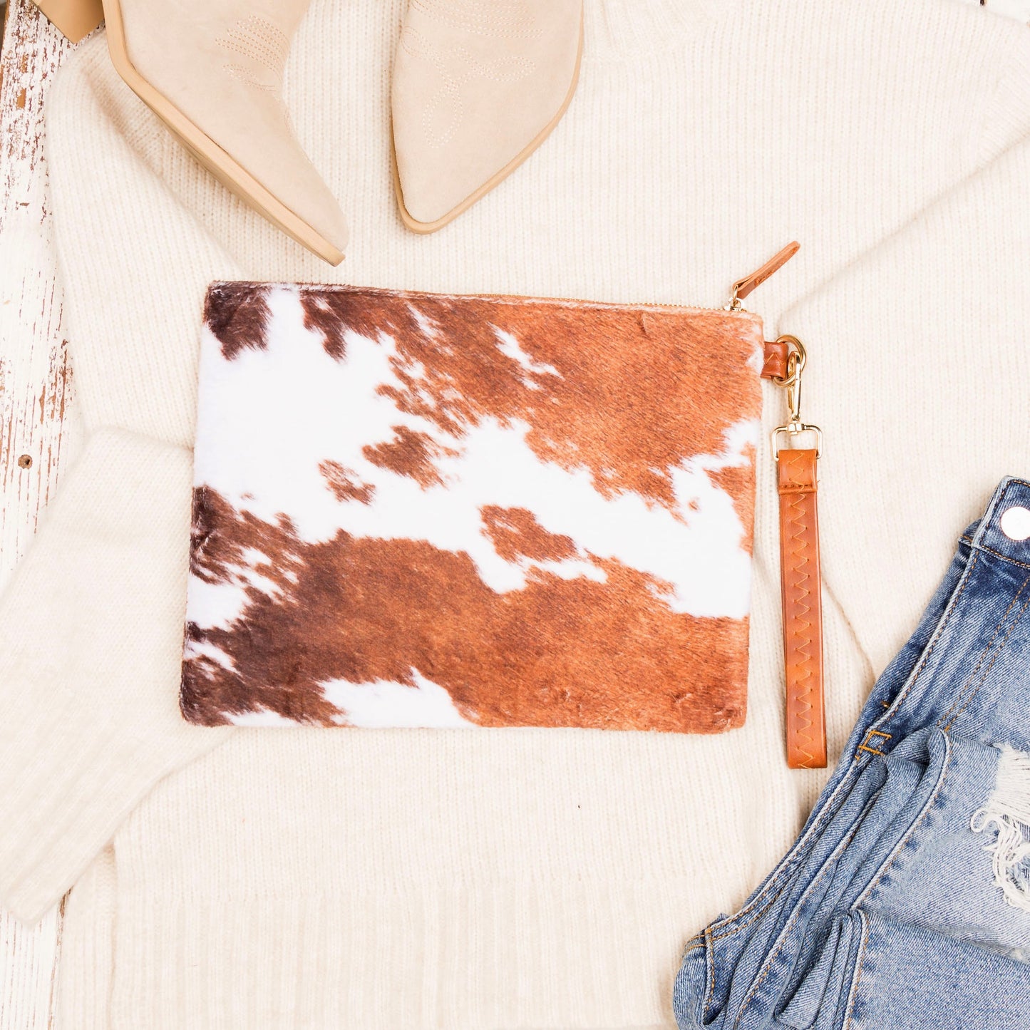 100% Polyester Faux Fur Cotton Lined Cow Print Removable Vegan Leather Wristlet Clutch