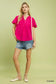 Fuchsia seersucker short sleeve top with lace trim, styled with denim shorts