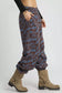 Side view of Umgee scenic print casual sweatpants with pocket, beige boots at Blueberi Boutique