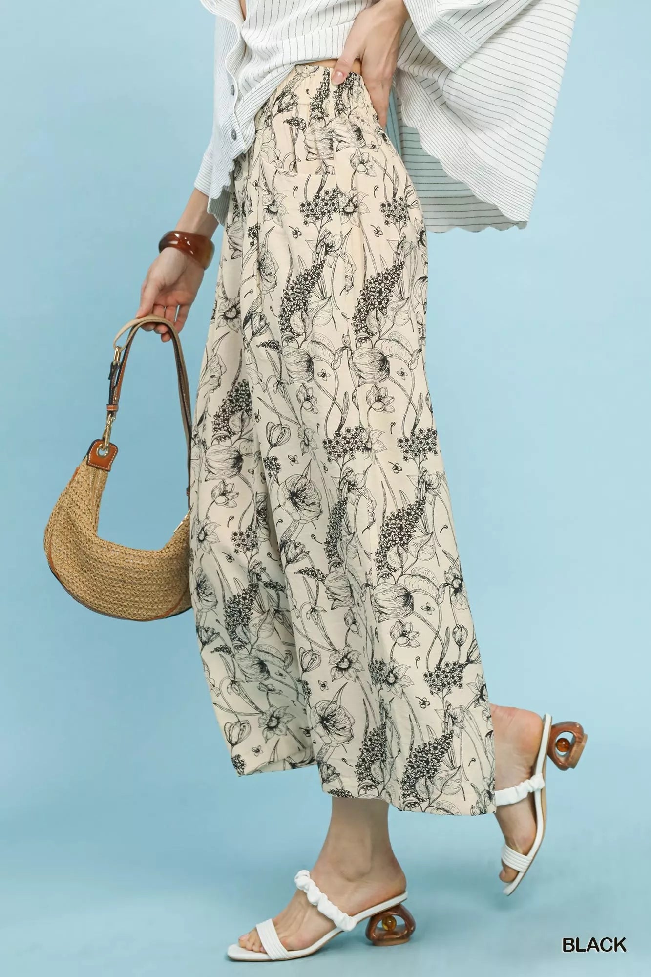Umgee two-tone floral print pants close-up showing black/white floral pattern