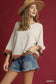 Blueberi Boutique Umgee scalloped hem color block top with brown coral trim, model posing side view