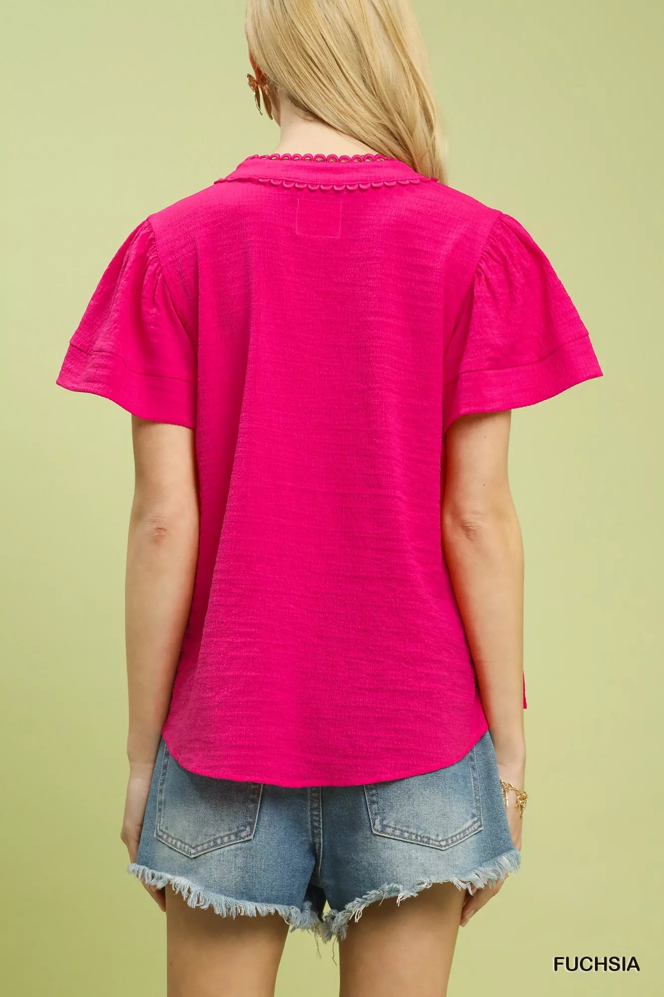 Back view of fuchsia umgee seersucker top with lace trim, 70% rayon 30% polyester, sizes S-L