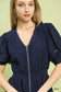 Blueberi Boutique navy midi dress close-up of zip-front and lace trim