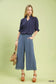Umgee linen wide leg cropped pants with lace trim, styled with navy blouse and orange platform sandals