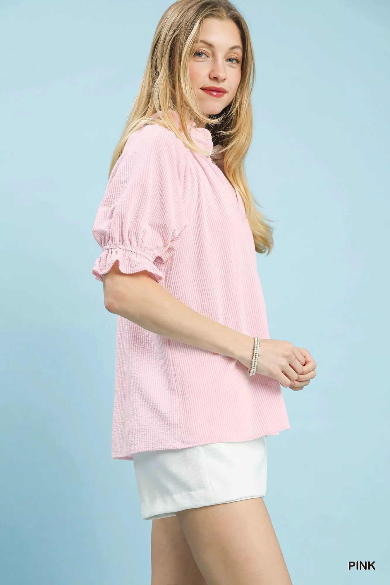 Umgee pink textured ruffle sleeve V-neck rayon blend top model side profile at Blueberi Boutique