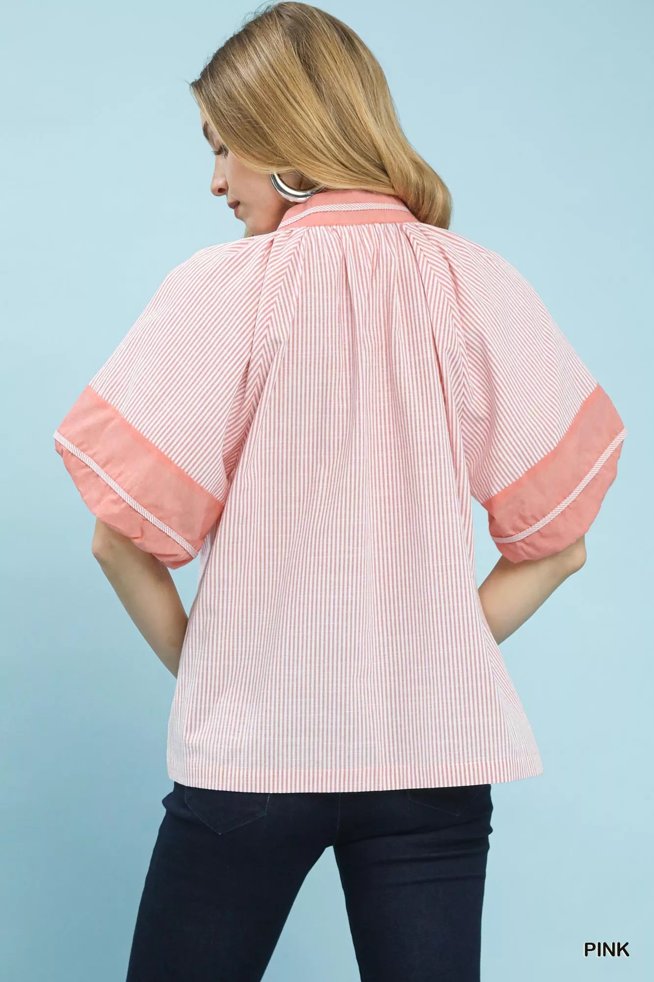 Back view of Umgee pink and white striped mixed puff sleeve blouse with coral puff sleeves