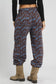 Brown/blue scenic print casual sweatpants with elastic waist, model wearing tan boots - Blueberi Boutique