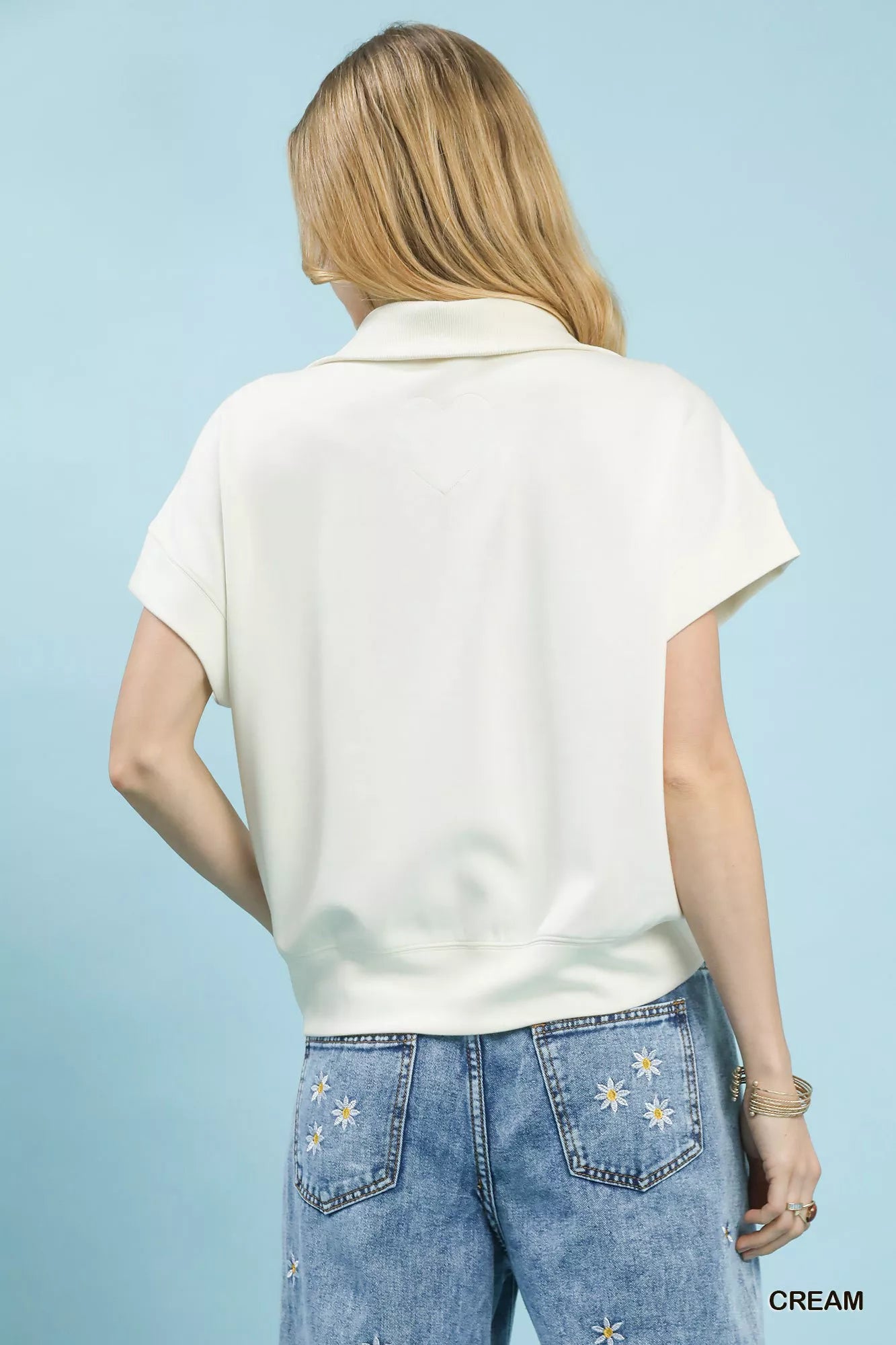 Blueberi Boutique back view of cream Umgee striped collared top with floral jeans