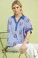 Umgee blue/white striped embroidered button-front boho blouse on model