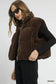 Close-up of brown sherpa-lined zip vest on model at Blueberi Boutique