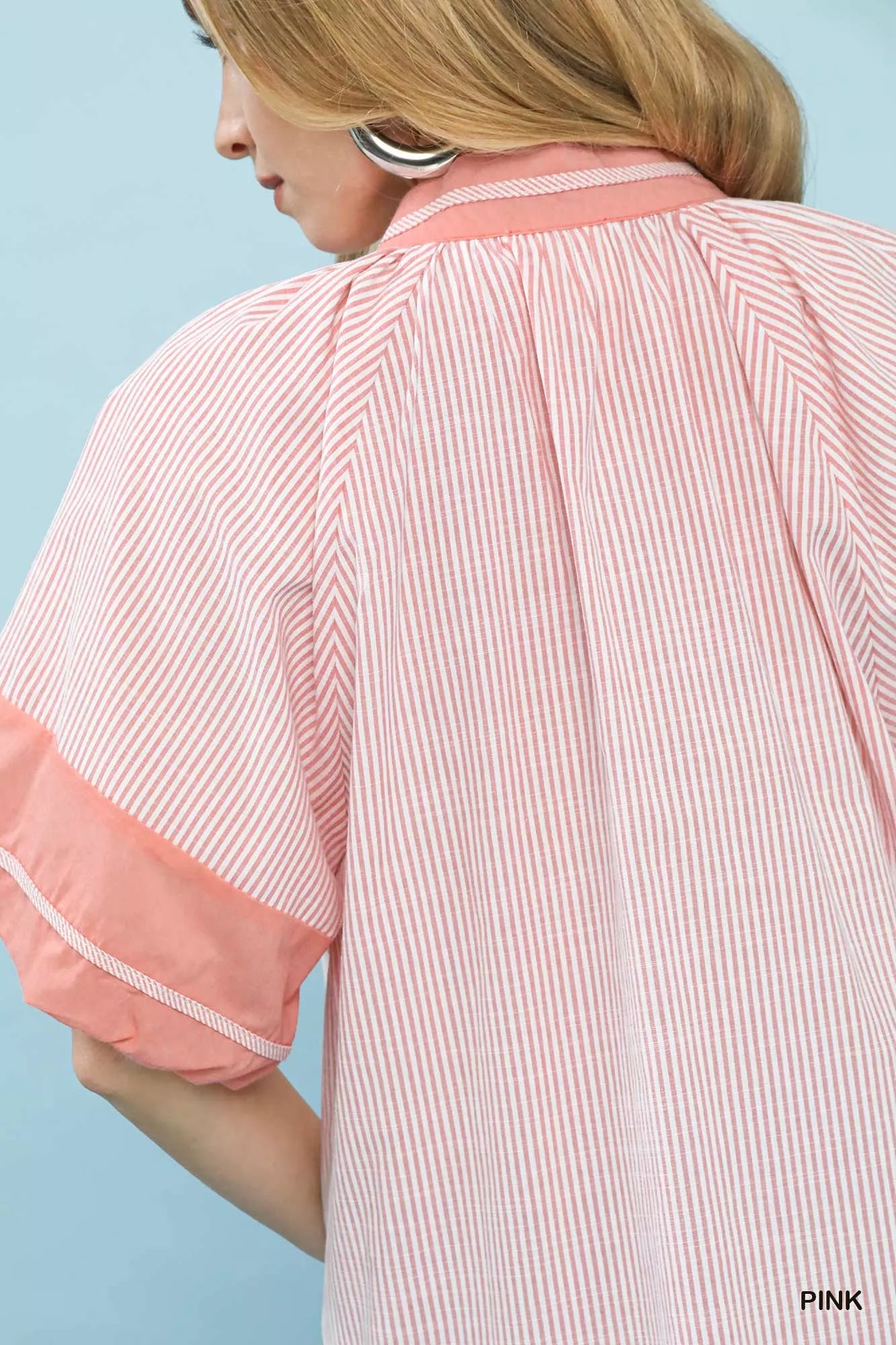 Close-up back view of Umgee pink and white striped mixed puff sleeve blouse with coral puff detail