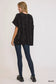 Umgee black open front knit cardigan with front pockets, model back view